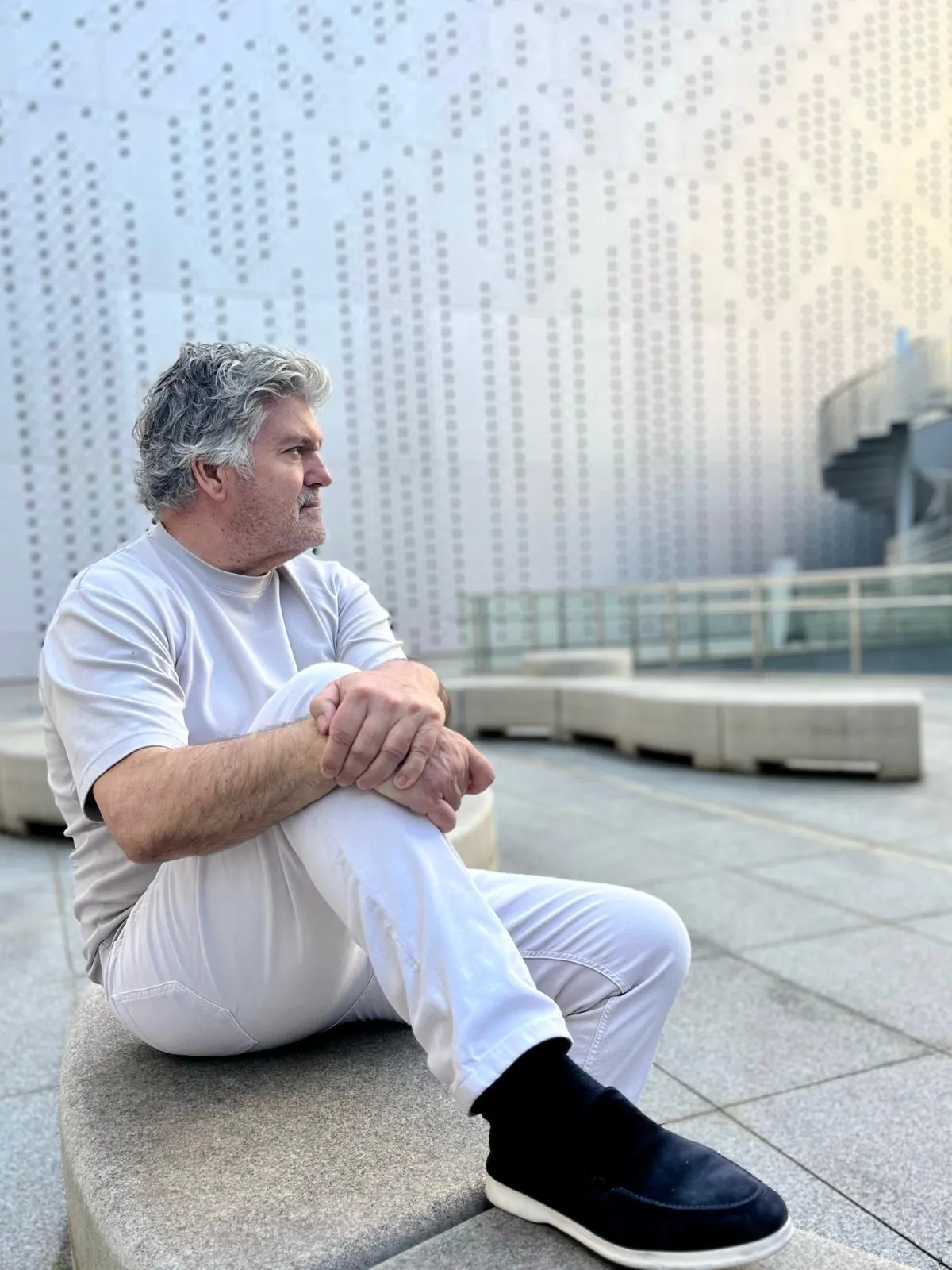 Juan Villalonga Navarro sitting on a terrace